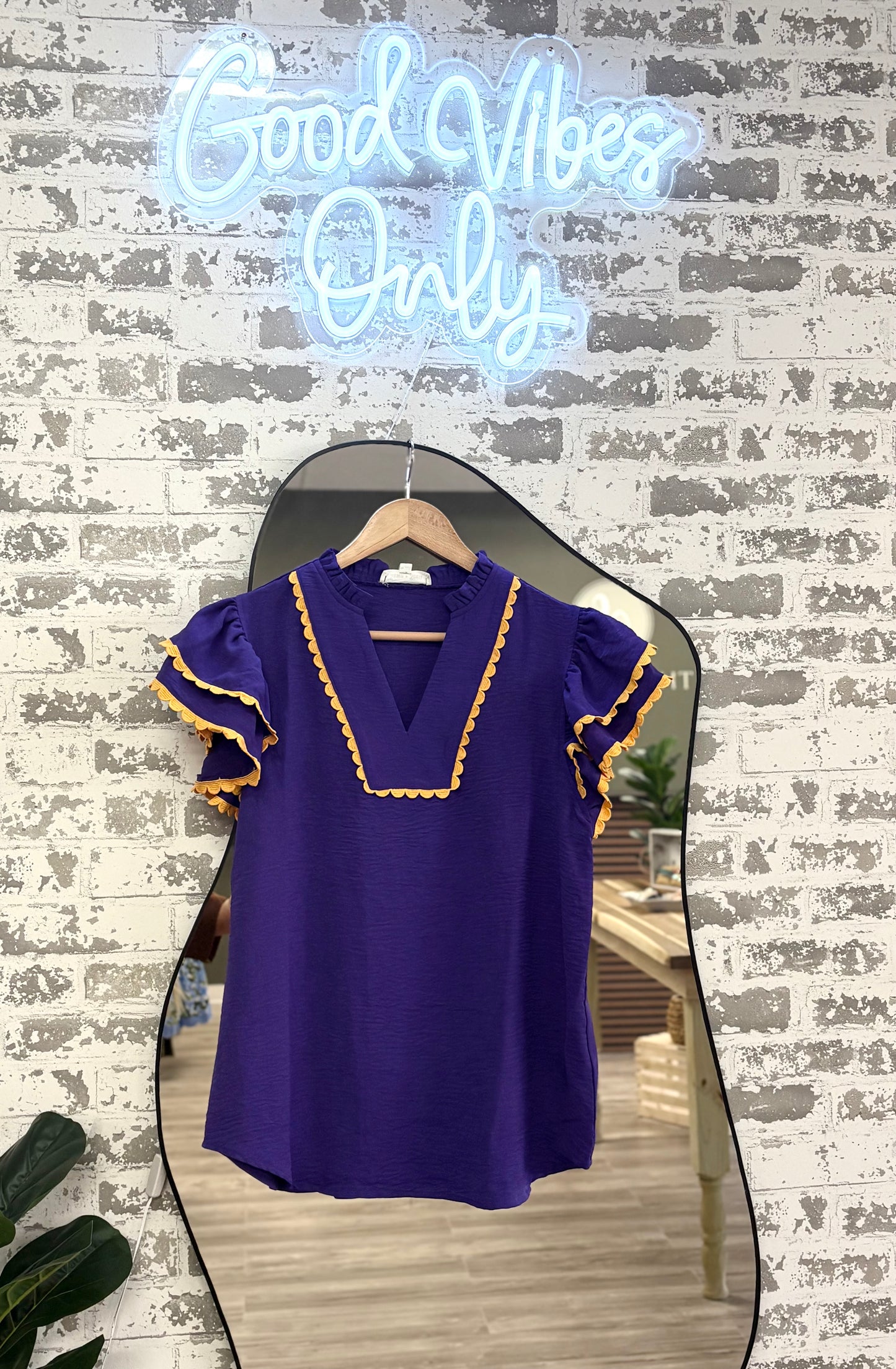 Purple gold trim ruffle blouse
