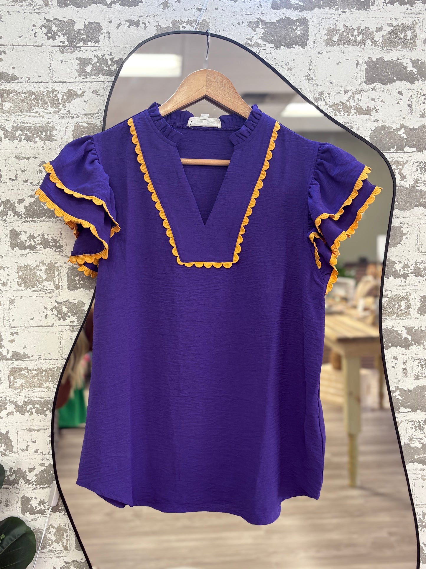 Purple gold trim ruffle blouse