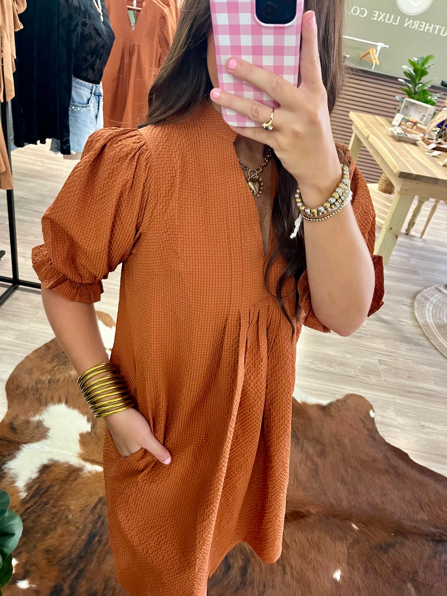 Burnt orange puff sleeve textured dress