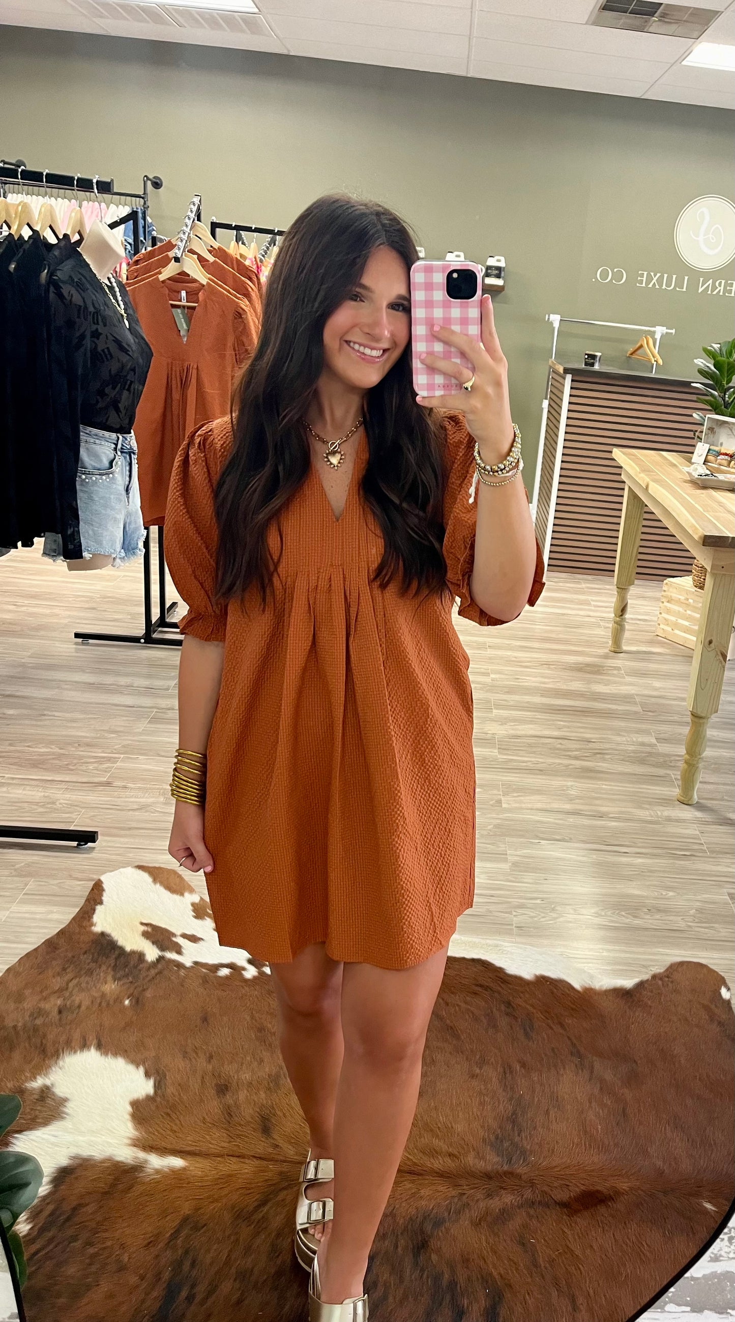 Burnt orange puff sleeve textured dress